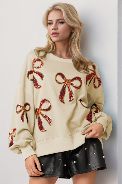 Double Take Christmas Bow Sequin Round Neck Dropped Shoulder Boho Sweatshirt [Spirit and Rebel] Cream S