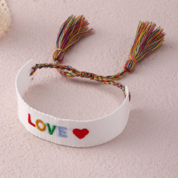 Sb9f7aac233734d6d9375375d46574d88v.jpg Embroidered Boho Tassel Bracelet