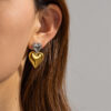 Sd72777cc68bd4ec28be7a3117db22c48i.jpg Twilight Charm Heart Dangle Earrings in Metallic Finish