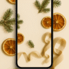 20251201_2028_Phone Wallpaper Mockup_remix_01kbdjktm4exvrw4ag9mx483jv Warm Citrus & Pine Flatlay – Aesthetic Christmas Phone Wallpaper