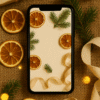 20251201_2042_Festive Christmas Wallpaper_remix_01kbdkdn9tfegb6qft4fwb29tr Warm Citrus & Pine Flatlay – Aesthetic Christmas Phone Wallpaper