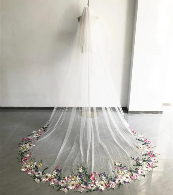 2 The Bellflower Veil, a cathedral wedding veil with three-dimensional embroidered wildflowers along the hem