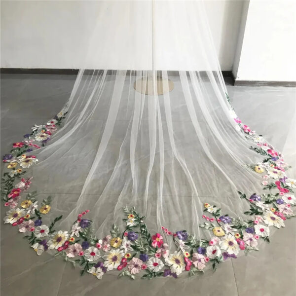 3 The Bellflower Veil, a cathedral wedding veil with three-dimensional embroidered wildflowers along the hem