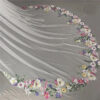 4 The Bellflower Veil, a cathedral wedding veil with three-dimensional embroidered wildflowers along the hem