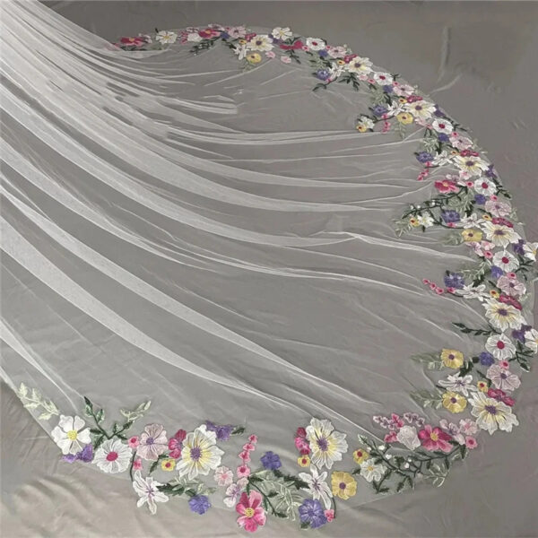 4 The Bellflower Veil, a cathedral wedding veil with three-dimensional embroidered wildflowers along the hem