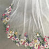 5 The Bellflower Veil, a cathedral wedding veil with three-dimensional embroidered wildflowers along the hem