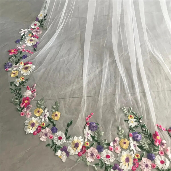 5 The Bellflower Veil, a cathedral wedding veil with three-dimensional embroidered wildflowers along the hem