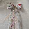6 The Poppy Bow, a wildflower embroidered wedding hair bow with veil tails on a comb