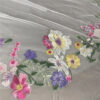 9 The Bellflower Veil, a cathedral wedding veil with three-dimensional embroidered wildflowers along the hem