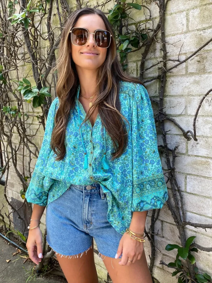 H0bfbc603db0d447ca4f84973e058ec66R.webp Rhapsody Button-Down Boho Floral Blouse with Tassel Ties