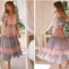 H0ed66813797d42f189bc757300ace9e40.webp Wanderlust Tie-Neck Floral Peasant Maxi Dress