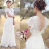 H931a03315abd4d55a83ea1f249f148c3h.webp Deep V illusion back with beaded floral appliqué on a chiffon boho wedding dress