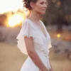 Hb63623b9a0eb42fdb97f227d181388c6y.webp The Olivette Gown — Beaded Chiffon Boho Wedding Dress with Flutter Sleeves Cream White – Spirit & Rebel