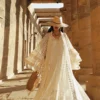 O1CN01545JRf2D9k8Y8vwEr_78728567.webp Desert Muse Whimsical Tiered Ruffle Bell Sleeve Lace Maxi Dress