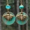 S02984f08443742a581054bb43b9bdbf5S.webp Sunlit Garden Boho Earrings with Floral Accents and Textured Discs