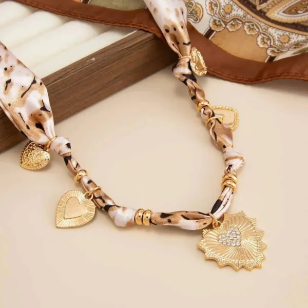 S03f9df58f1b54053b4e716e10928a6413.webp Romantic Serenade Necklace Gold Heart Charm with Animal Print Ribbon