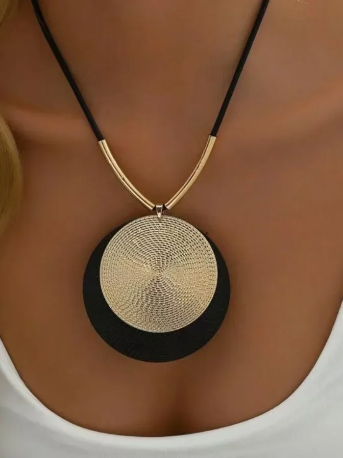 Dynamic Circular Necklace with Textured Gold and Black Pendant