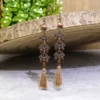 S0c23180089eb4c7f883aa9a8a073c8931.webp Odyssey Dangle Boho Tassel Earrings with Geometric Metal Accents