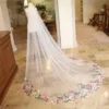 S0c2f8cc95ece4ecbaeca346e3d7bcc54W.webp The Bellflower Veil, a cathedral wedding veil with three-dimensional embroidered wildflowers along the hem