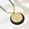 S123aa84fcfc84fa3bd9d5119effc71e8n.webp Dynamic Circular Necklace with Textured Gold and Black Pendant