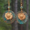 S13eb69af028b4ebdab2ebc03a3f96365y.webp Sunlit Garden Boho Earrings with Floral Accents and Textured Discs