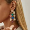 S18f85459471640beb0e167c34e67daa8Q.webp Colorful Statement Earrings with Cascading Gemstone Detail