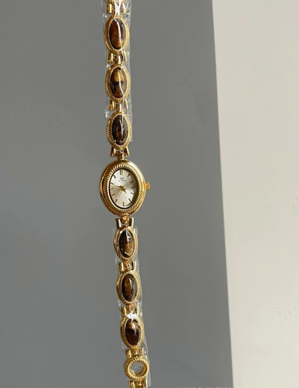 S1a38effd21ed4476bbfe9b8607ae42a7L.webp Elysian Gemstone Embellished Wristwatch with Bracelet Strap