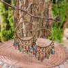 S1d7f4c65f2ce479594126c63d66447fbe.webp Dream Big Boho Earrings with Cascading Beads and Leaf Accents