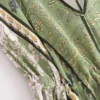 S1e37a8500c86448c8be3add02aee1ecby.webp Desert Bloom: Floral Print Backless Halter Maxi with Tassel Hem