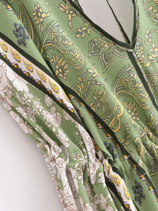 S1e37a8500c86448c8be3add02aee1ecby.webp Desert Bloom: Floral Print Backless Halter Maxi with Tassel Hem