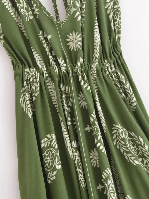 S212b8a094bbc4f41909b826ac68e26c8o.webp Desert Bloom: Floral Print Backless Halter Maxi with Tassel Hem