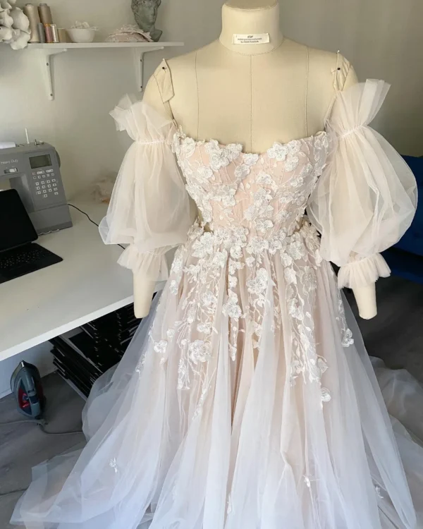 S21b037b8ae9f4cbdbb5b4364949ce6a41.webp Romantic Pink Embroidered Bridal Gown with Floral Accents