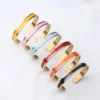 S22a197a3a9154835bbf545c0331d1e4aA.webp Vibrant Groove Colorful Enamel Bangle Bracelets Slip-On Style