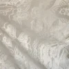 The Alba Veil, an ivory tassel fringe wedding veil in floral lace with a scalloped border