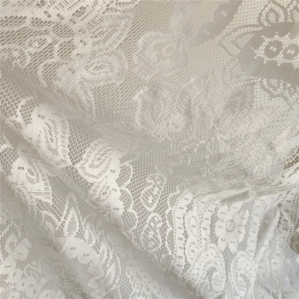 The Alba Veil, an ivory tassel fringe wedding veil in floral lace with a scalloped border
