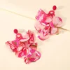 S29d3c71f09d94078811cc2bfd873486dD.webp Radiant Blooms Floral Statement Earrings with Layered Petals