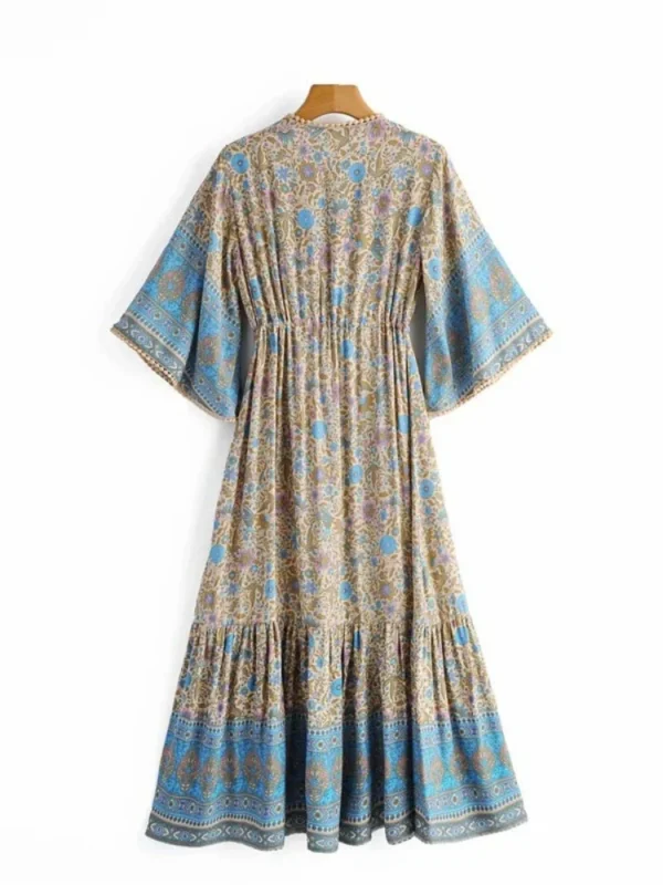 S2ba0c73683874d109e08e7d17676c515a.webp Free Spirit Bohemian Dress with Flowing Sleeves and Floral Detail