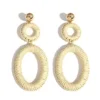 S3182d090f73e4c8fa5acc4e7637bf477X.webp Double oval wrapped raffia drop earrings with gold-tone studs