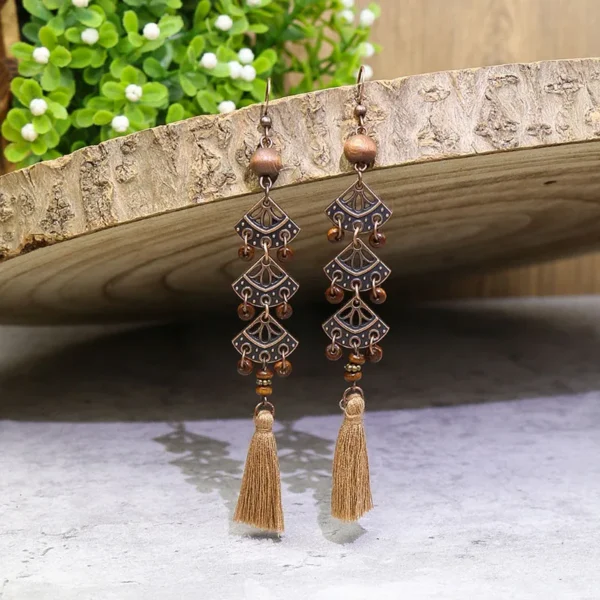 S3199a10ac73b441baeb6e1ef75b28820e.webp Odyssey Dangle Boho Tassel Earrings with Geometric Metal Accents