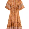 S36a78b46ce3c45729b7436a9f284b45b3.webp Free Spirit Bohemian Dress with Flowing Sleeves and Floral Detail