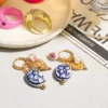 S3f7b3029db4b43f4b321729405cdb858L.webp Amour Porcelain Heart Charm Hoop Earrings