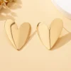 S41476817a1524295883c5f9ed1e617c5L.webp Sculpted Heart Statement Earrings
