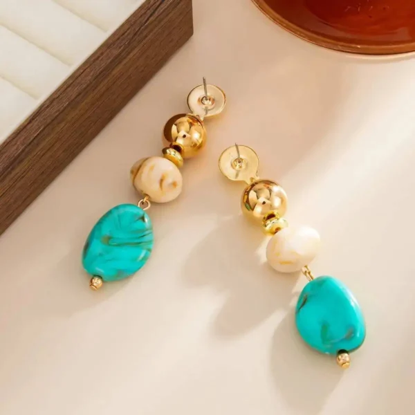S47a069f5a7354bd39cd49becaf659035m.webp Boho Earrings with Bold Stone Accents and Gold Highlights
