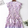 S47a653d7ead14af8a467b7b9c9ca5951c.webp Floral Ruffle Mini Dress with Relaxed Fit and Button Detail