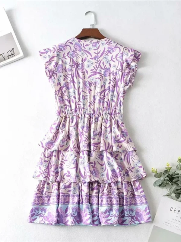 S47a653d7ead14af8a467b7b9c9ca5951c.webp Floral Ruffle Mini Dress with Relaxed Fit and Button Detail
