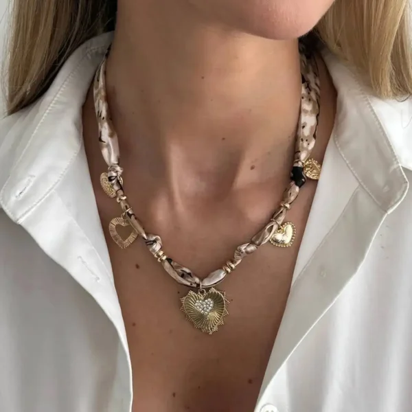 S48192679090c4277975fdaa0b89280b76.webp Romantic Serenade Necklace Gold Heart Charm with Animal Print Ribbon