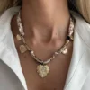 S48469527e183401a975805067e0eb592f.webp Romantic Serenade Necklace Gold Heart Charm with Animal Print Ribbon