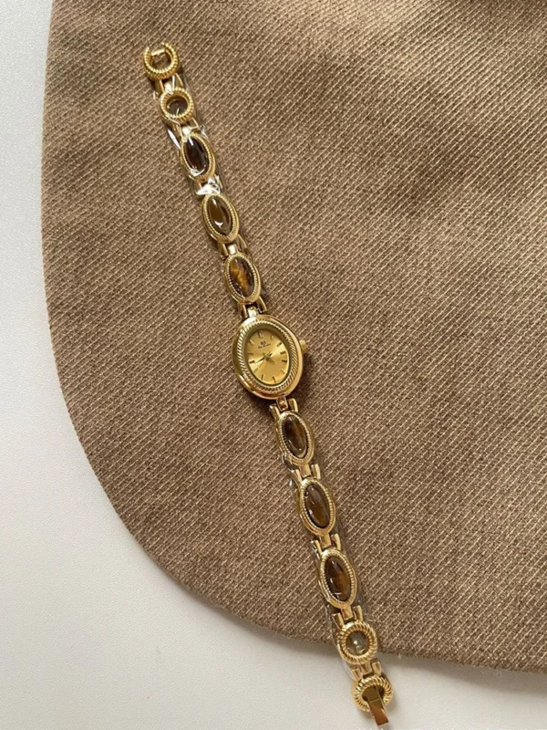 S4ba29db658eb4ccfbe1ddb664c904f5bj.webp Elysian Gemstone Embellished Wristwatch with Bracelet Strap