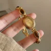 S4ba9f55c480d41e68b763065d2359e7d3.webp Elysian Gemstone Embellished Wristwatch with Bracelet Strap