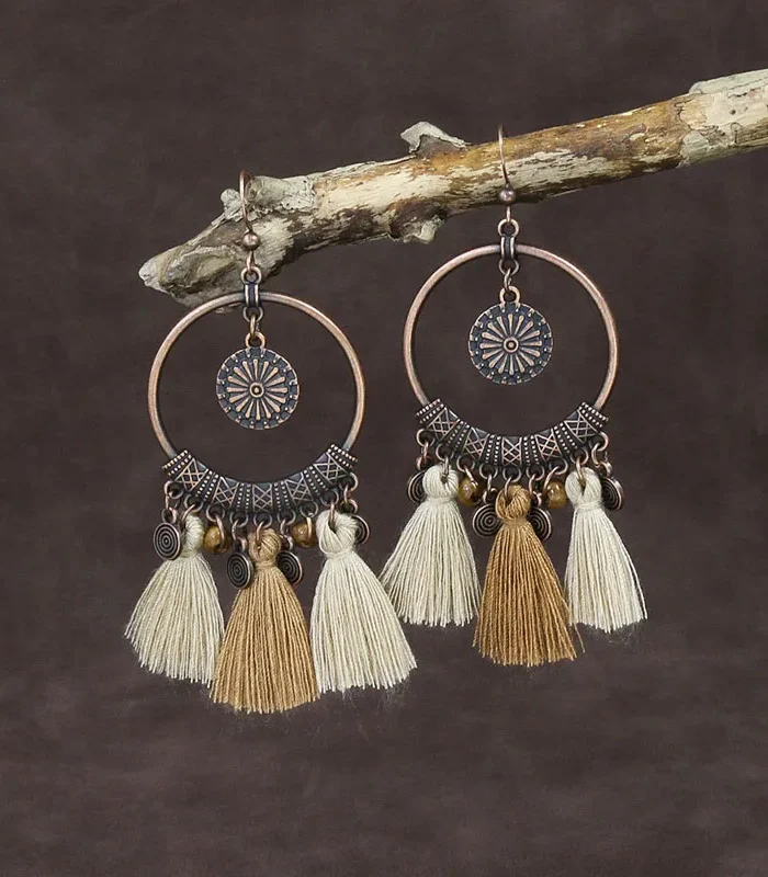 S4e6cb111e0c246f8a84b2a735717e2fcj.webp Odyssey Dangle Boho Tassel Earrings with Geometric Metal Accents
